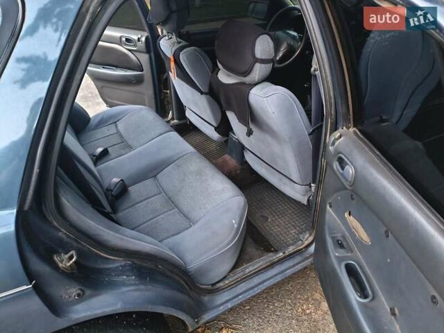 Синий Киа Сефия, объемом двигателя 1.6 л и пробегом 315 тыс. км за 1350 $, фото 3 на Automoto.ua