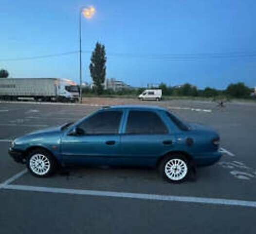 Синий Киа Сефия, объемом двигателя 1.6 л и пробегом 450 тыс. км за 800 $, фото 1 на Automoto.ua