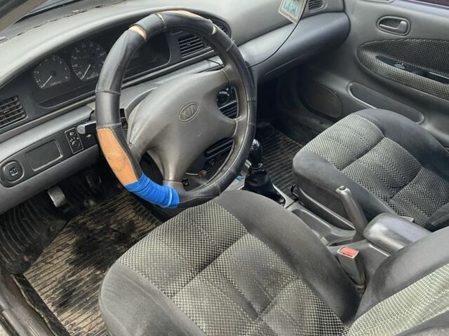 Синий Киа Сефия, объемом двигателя 1.5 л и пробегом 200 тыс. км за 710 $, фото 3 на Automoto.ua