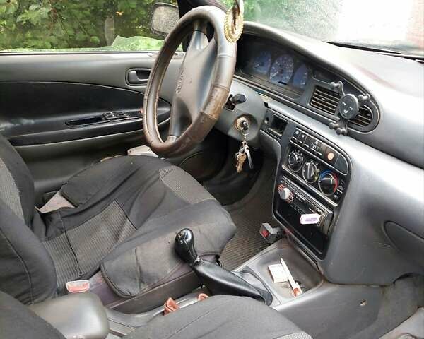 Синий Киа Сефия, объемом двигателя 1.6 л и пробегом 310 тыс. км за 850 $, фото 2 на Automoto.ua