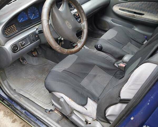 Синий Киа Сефия, объемом двигателя 1.6 л и пробегом 310 тыс. км за 850 $, фото 4 на Automoto.ua