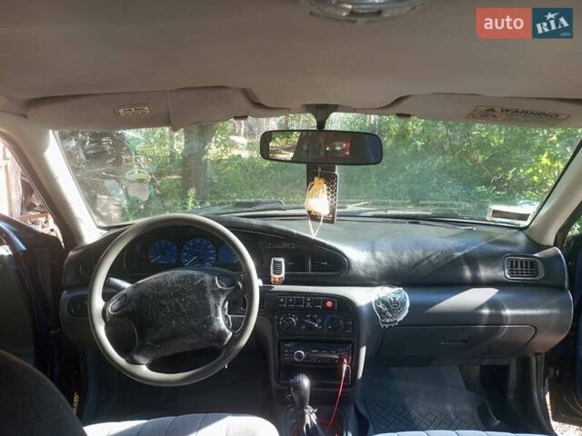 Синий Киа Сефия, объемом двигателя 1.8 л и пробегом 233 тыс. км за 1250 $, фото 5 на Automoto.ua