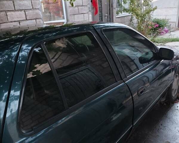 Зелений Кіа Сефія, об'ємом двигуна 1.6 л та пробігом 149 тис. км за 1200 $, фото 1 на Automoto.ua