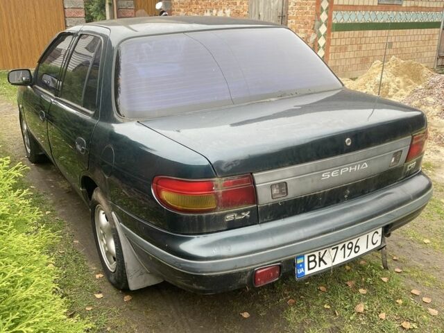 Зеленый Киа Сефия, объемом двигателя 1.6 л и пробегом 320 тыс. км за 870 $, фото 2 на Automoto.ua