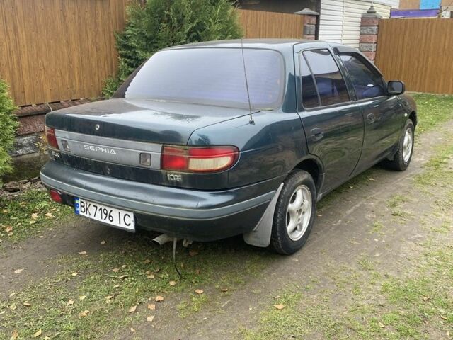 Зеленый Киа Сефия, объемом двигателя 1.6 л и пробегом 320 тыс. км за 870 $, фото 1 на Automoto.ua