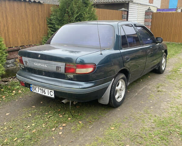 Зеленый Киа Сефия, объемом двигателя 1.6 л и пробегом 320 тыс. км за 870 $, фото 1 на Automoto.ua