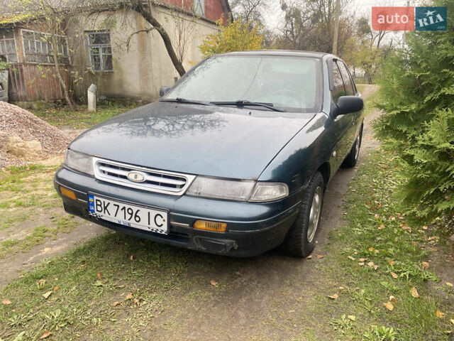 Зеленый Киа Сефия, объемом двигателя 1.6 л и пробегом 320 тыс. км за 870 $, фото 4 на Automoto.ua