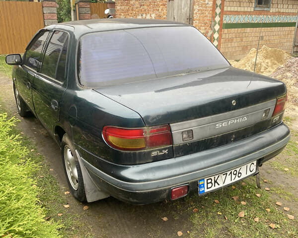 Зеленый Киа Сефия, объемом двигателя 1.6 л и пробегом 320 тыс. км за 870 $, фото 2 на Automoto.ua