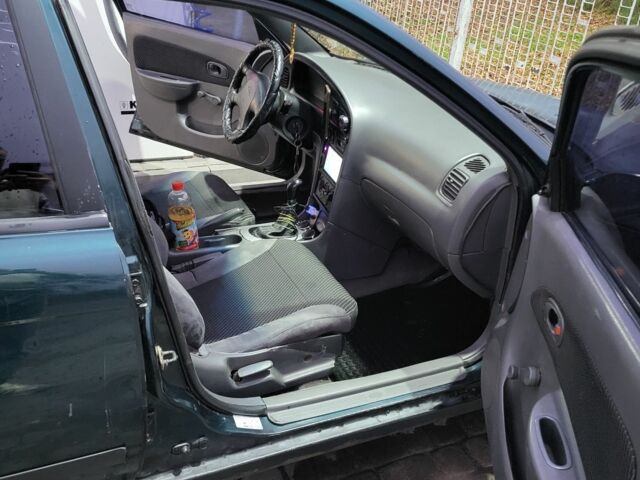 Зелений Кіа Сефія, об'ємом двигуна 1.5 л та пробігом 280 тис. км за 1200 $, фото 10 на Automoto.ua