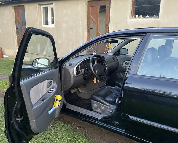 Черный Киа Шума, объемом двигателя 1.6 л и пробегом 308 тыс. км за 3100 $, фото 13 на Automoto.ua