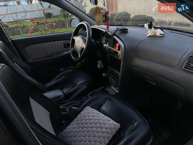 Черный Киа Шума, объемом двигателя 1.6 л и пробегом 308 тыс. км за 3100 $, фото 15 на Automoto.ua