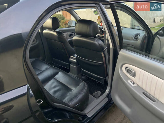 Черный Киа Шума, объемом двигателя 1.6 л и пробегом 308 тыс. км за 3100 $, фото 17 на Automoto.ua