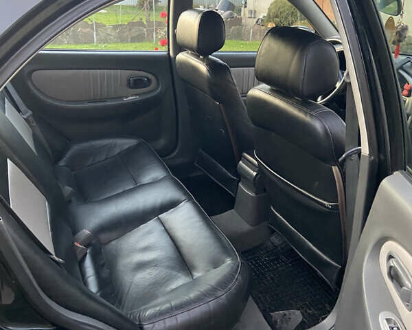 Черный Киа Шума, объемом двигателя 1.6 л и пробегом 308 тыс. км за 3100 $, фото 16 на Automoto.ua