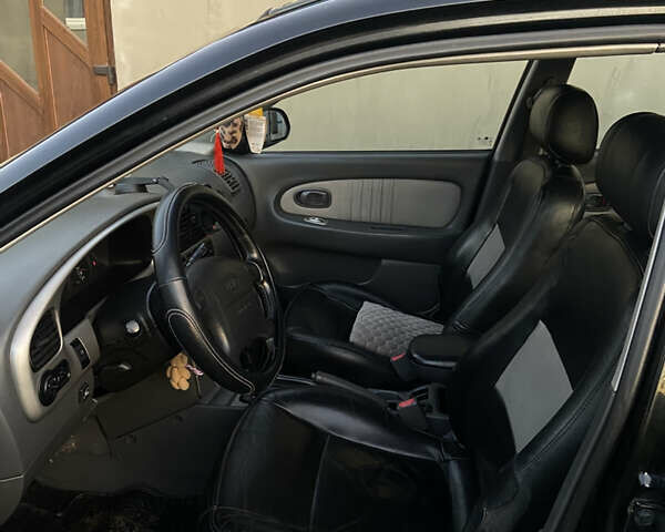 Черный Киа Шума, объемом двигателя 1.6 л и пробегом 308 тыс. км за 3100 $, фото 11 на Automoto.ua