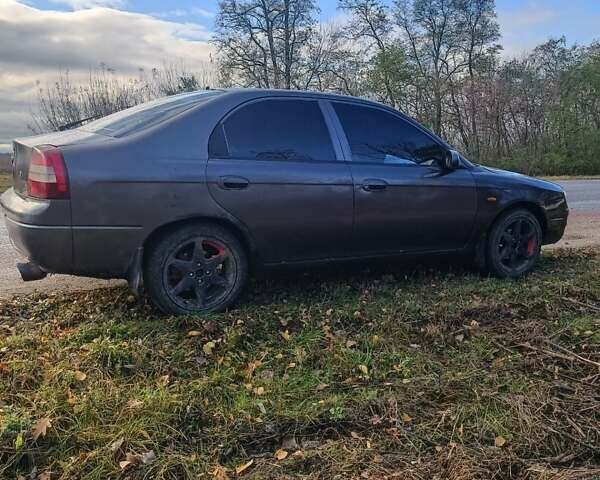 Фиолетовый Киа Шума, объемом двигателя 1.5 л и пробегом 273 тыс. км за 2000 $, фото 3 на Automoto.ua