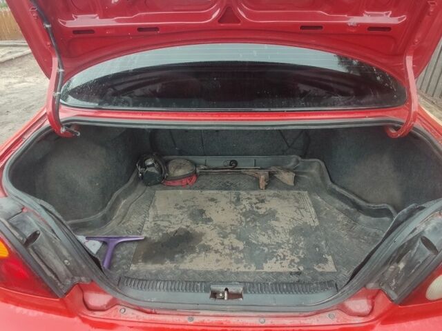 Червоний Кіа Шума, об'ємом двигуна 1.5 л та пробігом 1 тис. км за 1850 $, фото 11 на Automoto.ua