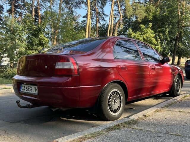 Красный Киа Шума, объемом двигателя 1.5 л и пробегом 215 тыс. км за 1700 $, фото 7 на Automoto.ua