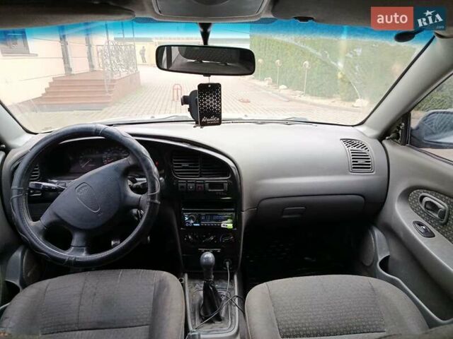 Серый Киа Шума, объемом двигателя 1.6 л и пробегом 300 тыс. км за 2499 $, фото 5 на Automoto.ua