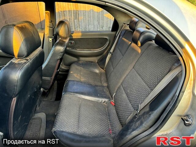 Сірий Кіа Шума, об'ємом двигуна 1.8 л та пробігом 245 тис. км за 1300 $, фото 9 на Automoto.ua
