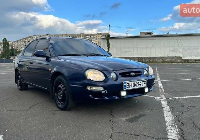 Синий Киа Шума, объемом двигателя 1.8 л и пробегом 310 тыс. км за 1500 $, фото 1 на Automoto.ua