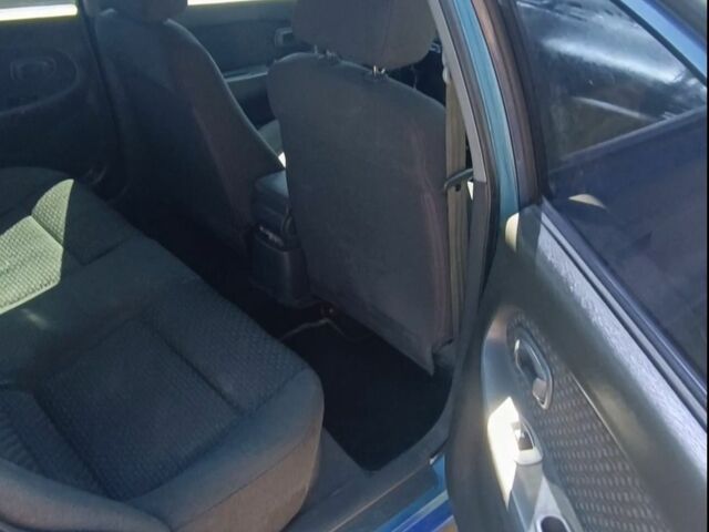 Синій Кіа Шума, об'ємом двигуна 1.6 л та пробігом 300 тис. км за 1200 $, фото 3 на Automoto.ua