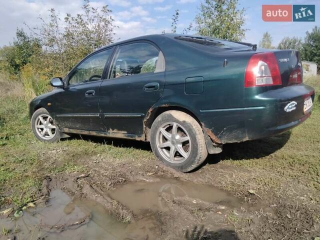 Зеленый Киа Шума, объемом двигателя 1.8 л и пробегом 130 тыс. км за 2600 $, фото 3 на Automoto.ua