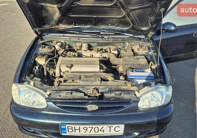 Зеленый Киа Шума, объемом двигателя 1.5 л и пробегом 328 тыс. км за 2000 $, фото 16 на Automoto.ua