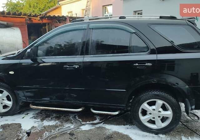 Черный Киа Соренто, объемом двигателя 2.5 л и пробегом 313 тыс. км за 6100 $, фото 6 на Automoto.ua