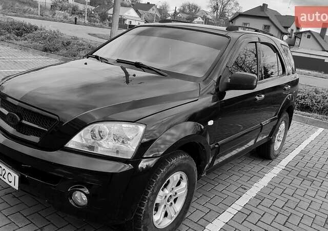 Черный Киа Соренто, объемом двигателя 2.5 л и пробегом 240 тыс. км за 7500 $, фото 1 на Automoto.ua