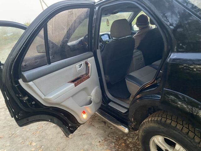 Черный Киа Соренто, объемом двигателя 2.5 л и пробегом 200 тыс. км за 7100 $, фото 11 на Automoto.ua