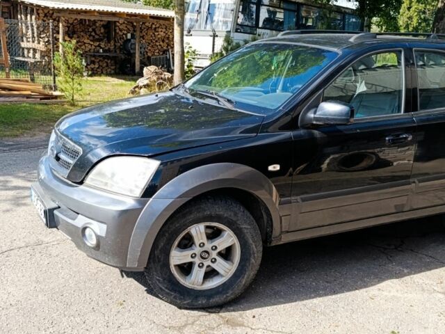 Черный Киа Соренто, объемом двигателя 2.4 л и пробегом 310 тыс. км за 3650 $, фото 2 на Automoto.ua