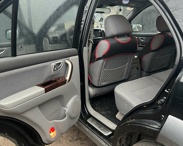 Черный Киа Соренто, объемом двигателя 2.5 л и пробегом 140 тыс. км за 7500 $, фото 2 на Automoto.ua