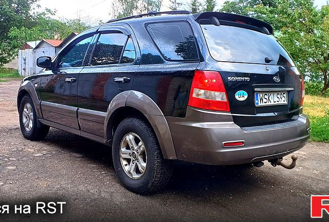 Черный Киа Соренто, объемом двигателя 2.5 л и пробегом 350 тыс. км за 4000 $, фото 1 на Automoto.ua
