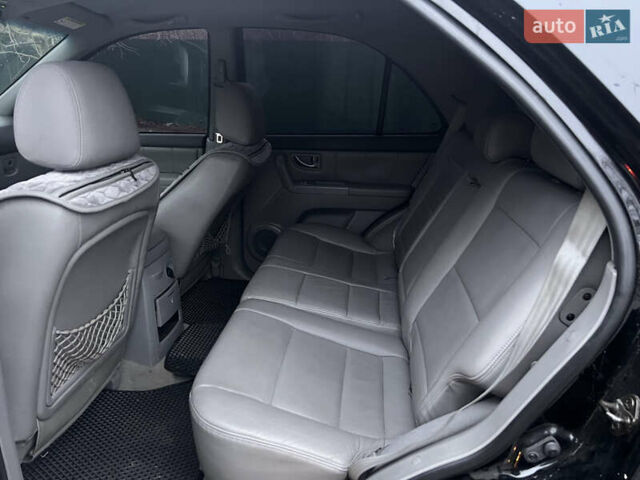 Черный Киа Соренто, объемом двигателя 2.5 л и пробегом 340 тыс. км за 7500 $, фото 12 на Automoto.ua