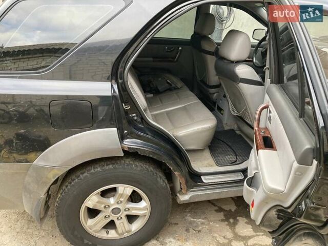 Черный Киа Соренто, объемом двигателя 2.5 л и пробегом 220 тыс. км за 4500 $, фото 4 на Automoto.ua