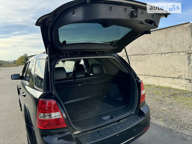 Черный Киа Соренто, объемом двигателя 2.5 л и пробегом 291 тыс. км за 9000 $, фото 7 на Automoto.ua