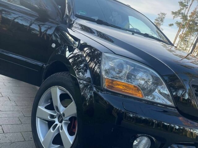 Черный Киа Соренто, объемом двигателя 2.5 л и пробегом 255 тыс. км за 8600 $, фото 1 на Automoto.ua