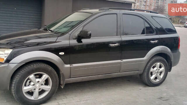 Черный Киа Соренто, объемом двигателя 2.5 л и пробегом 260 тыс. км за 7900 $, фото 1 на Automoto.ua