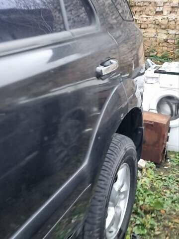 Черный Киа Соренто, объемом двигателя 2.5 л и пробегом 300 тыс. км за 4600 $, фото 1 на Automoto.ua