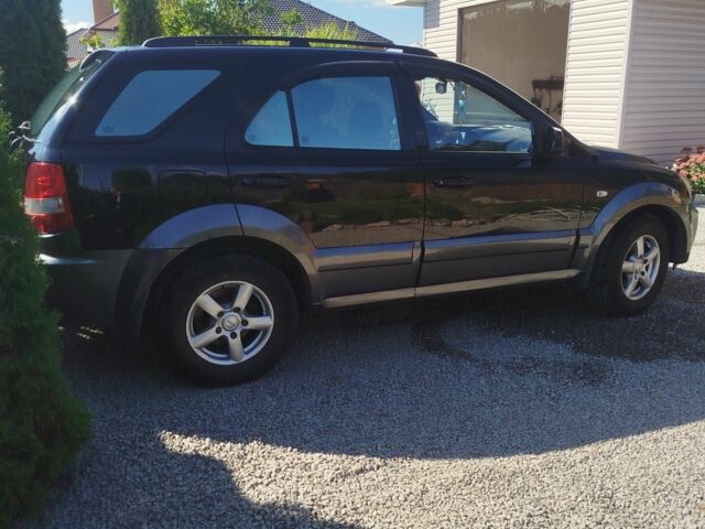 Чорний Кіа Соренто, об'ємом двигуна 2.4 л та пробігом 300 тис. км за 7300 $, фото 1 на Automoto.ua