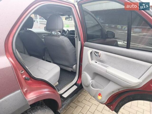 Красный Киа Соренто, объемом двигателя 2.5 л и пробегом 308 тыс. км за 7500 $, фото 11 на Automoto.ua