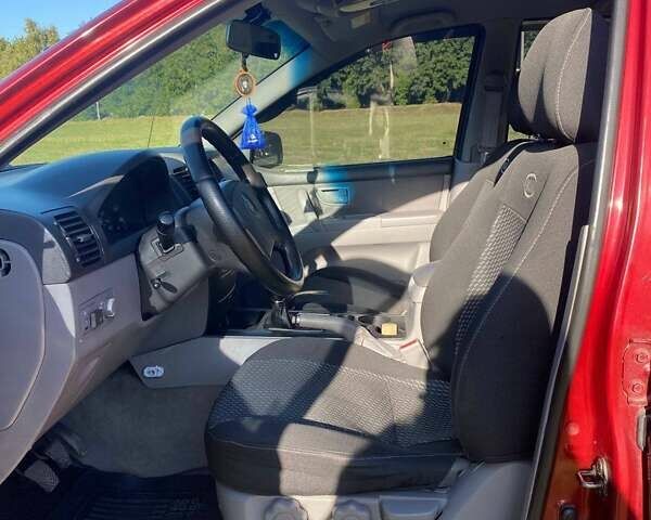 Красный Киа Соренто, объемом двигателя 2.4 л и пробегом 282 тыс. км за 6500 $, фото 12 на Automoto.ua