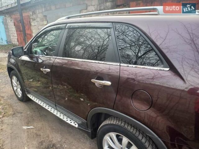 Красный Киа Соренто, объемом двигателя 2.4 л и пробегом 179 тыс. км за 12600 $, фото 1 на Automoto.ua
