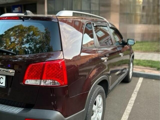 Червоний Кіа Соренто, об'ємом двигуна 2.4 л та пробігом 205 тис. км за 11000 $, фото 1 на Automoto.ua