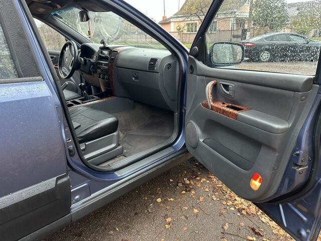 Синий Киа Соренто, объемом двигателя 2.5 л и пробегом 230 тыс. км за 4200 $, фото 11 на Automoto.ua