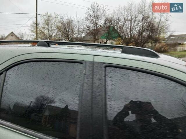 Зеленый Киа Соренто, объемом двигателя 2.5 л и пробегом 340 тыс. км за 4500 $, фото 1 на Automoto.ua