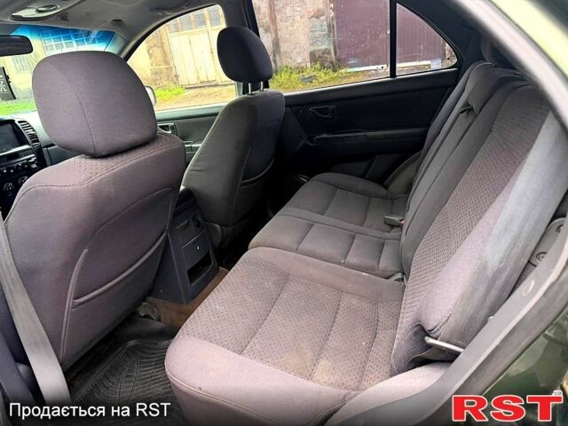 Зеленый Киа Соренто, объемом двигателя 2.5 л и пробегом 256 тыс. км за 3400 $, фото 6 на Automoto.ua