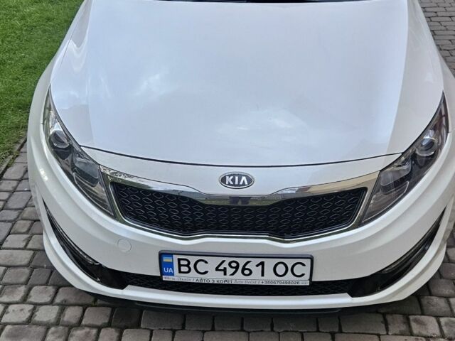 Белый Киа K5, объемом двигателя 2 л и пробегом 255 тыс. км за 10300 $, фото 1 на Automoto.ua