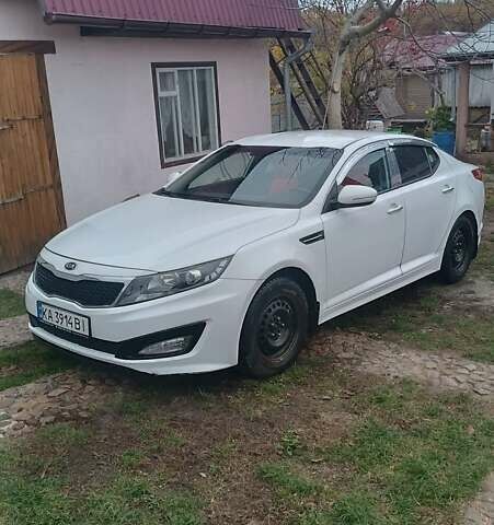 Белый Киа K5, объемом двигателя 2 л и пробегом 230 тыс. км за 10200 $, фото 11 на Automoto.ua