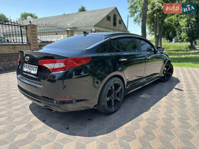Черный Киа K5, объемом двигателя 2 л и пробегом 234 тыс. км за 7999 $, фото 1 на Automoto.ua